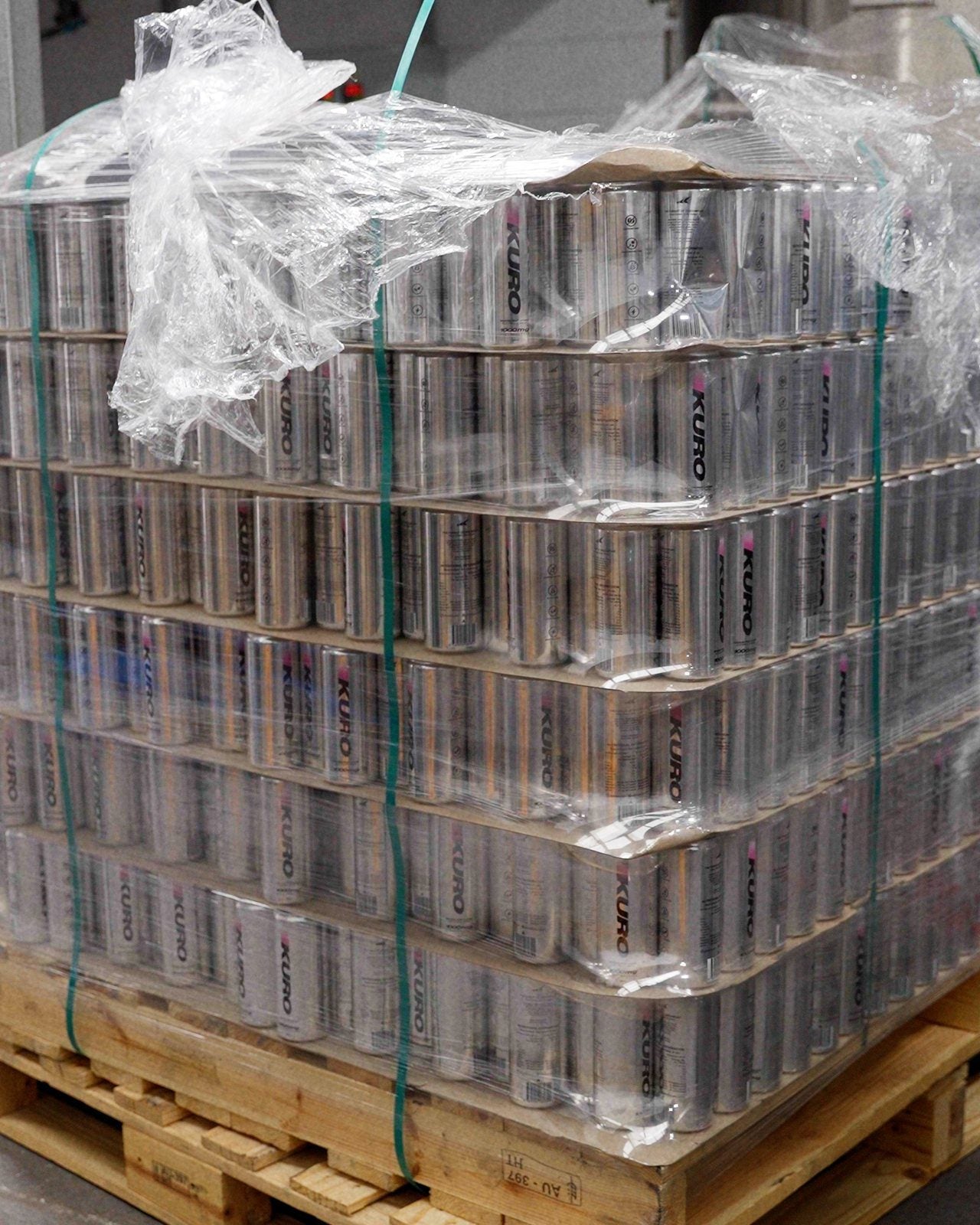 A wrapped pallet of KURO cans at the factory
